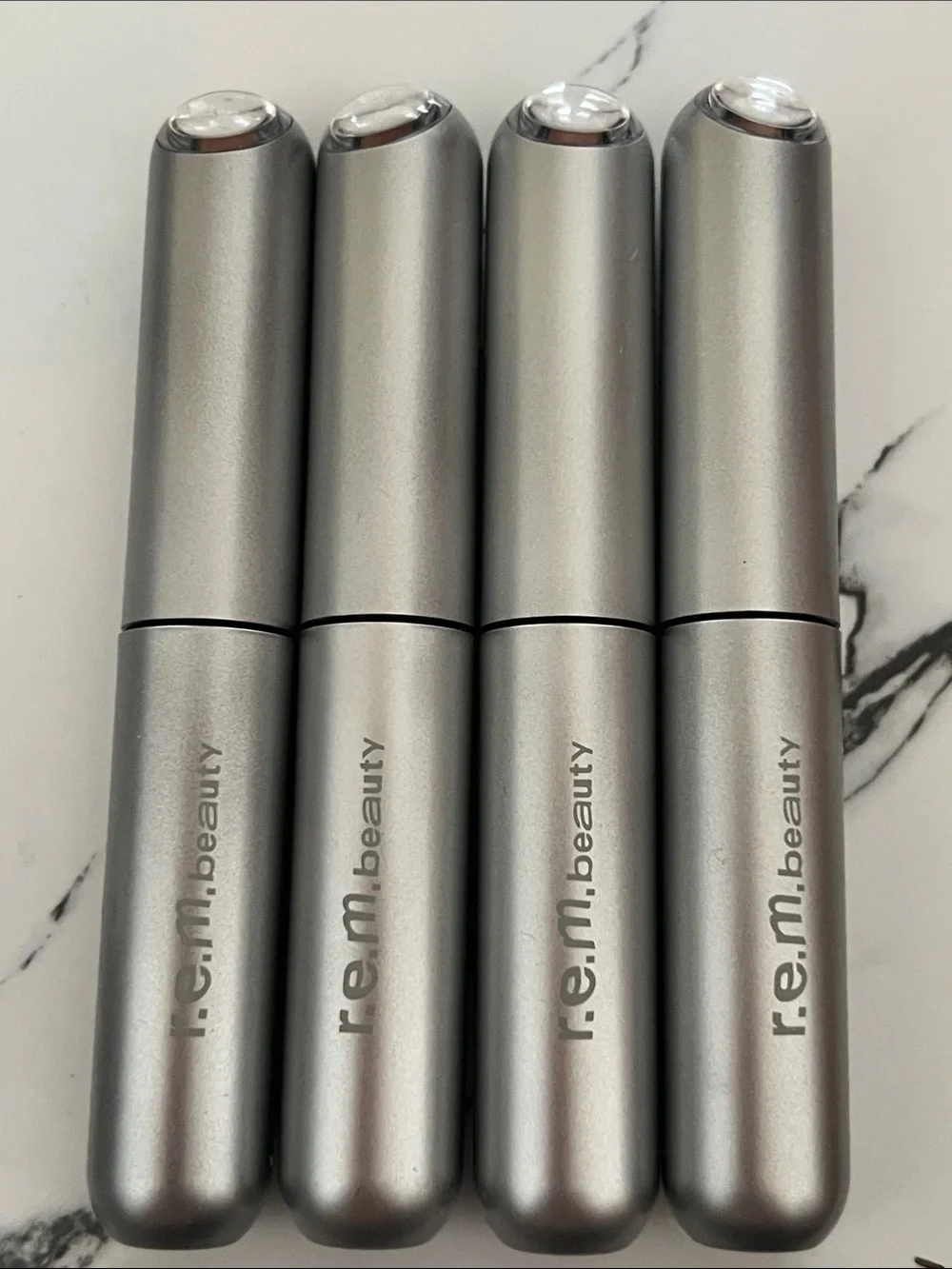 r.e.m. beauty Nude Lipstick — Sleek Silver Finish Closes with Magnet